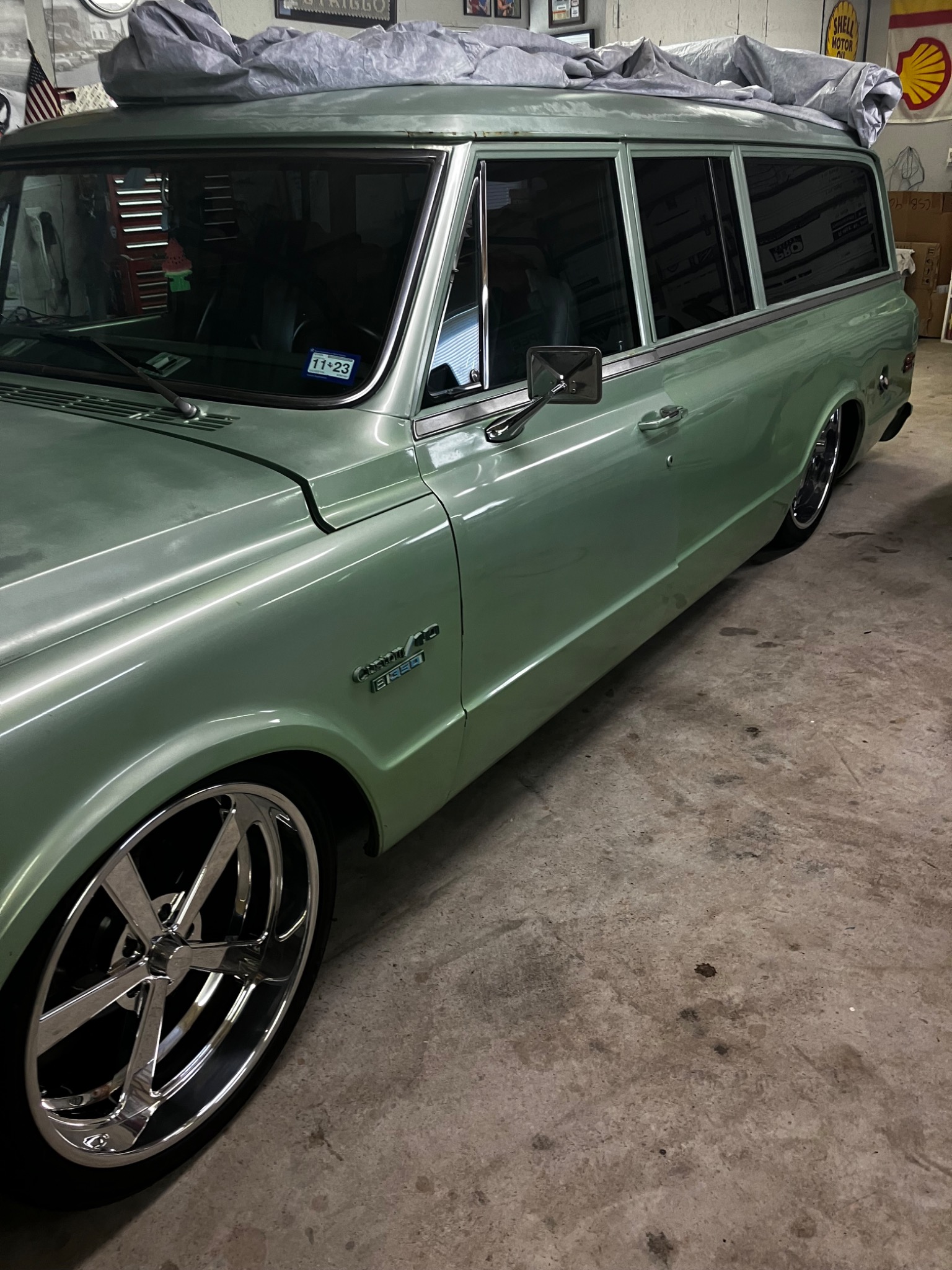Classic Chevy Suburban restoration with chrome wheels